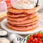 Stack of cake mix pancakes with icing syrup and fresh strawberries on side.