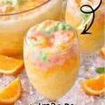 Colorful Rainbow Sherbet Punch with oranges for Christmas celebration.