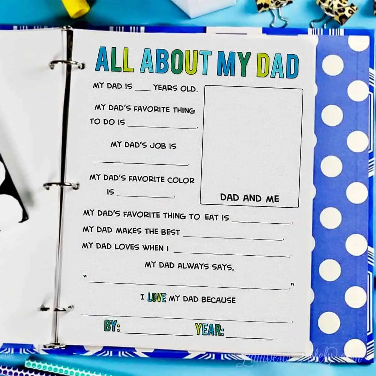 All about my dad printable page being filled out by a child inside a blue polka dot memory binder.