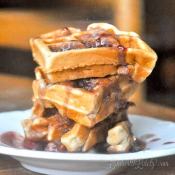 peanut butter waffles covered in jelly syrup.