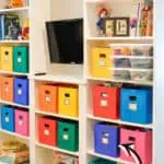 Ikea built-in with Billy bookcases and colorful storage bins for organized living.