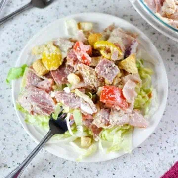plate full of grinder salad with a fork.
