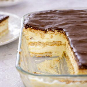 pieces of no bake chocolate eclair cake removed from a baking dish.