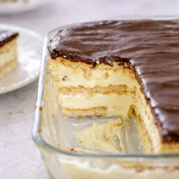 pieces of no bake chocolate eclair cake removed from a baking dish.