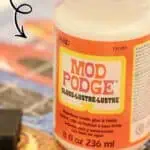 Using Mod Podge to glue and preserve a jigsaw puzzle easily.