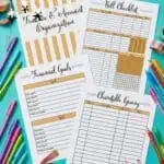 Printable debt payoff and bill tracker sheets with colorful pens and washi tape.