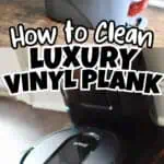Robot vacuum cleaner cleaning vinyl plank flooring in a modern home.