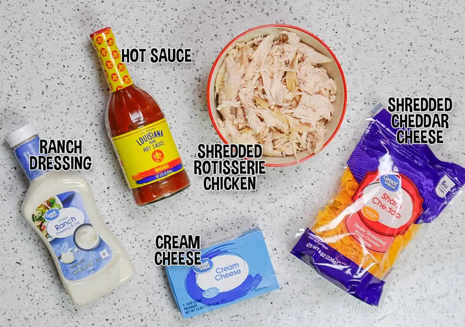 Rotisserie chicken, cream cheese, ranch, hot sauce, and cheddar for crock pot buffalo chicken dip