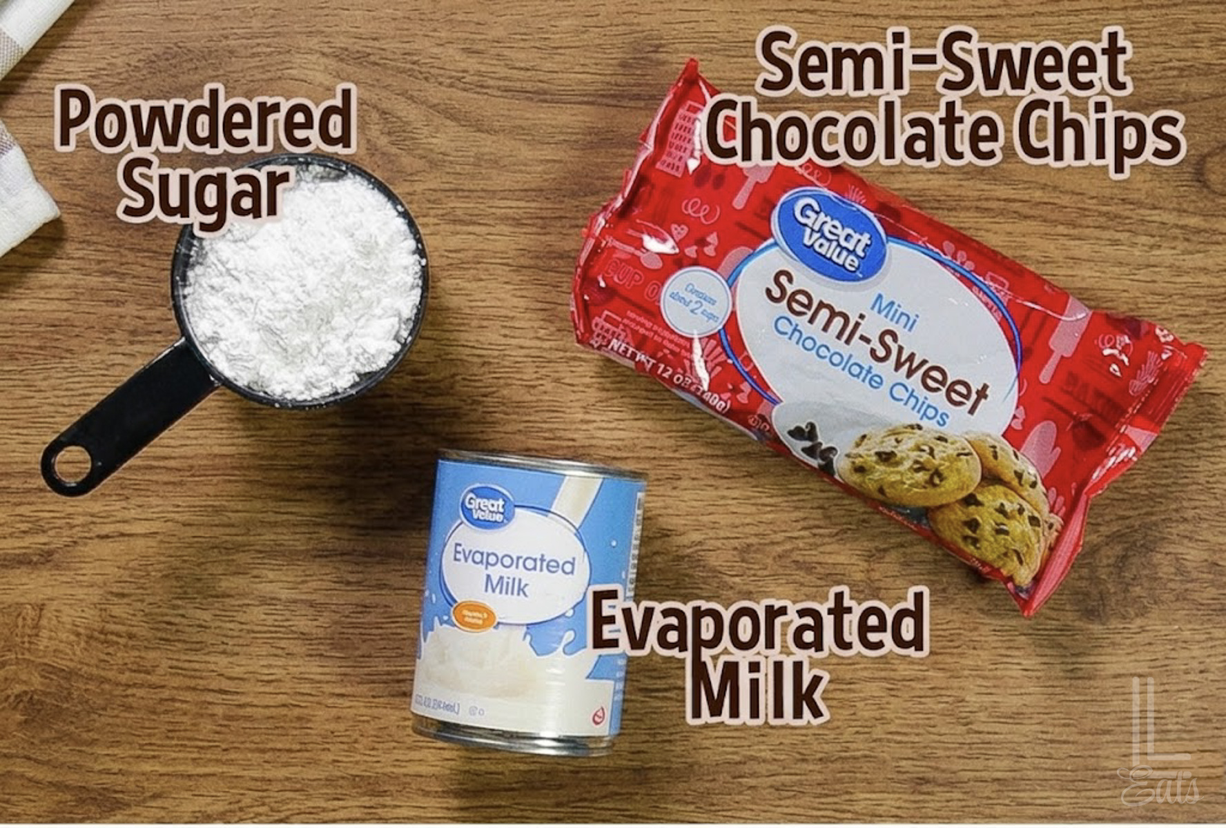 3 ingredients for an easy chocolate dip; evaporated milk, semi-sweet chocolate chips, and powdered sugar.