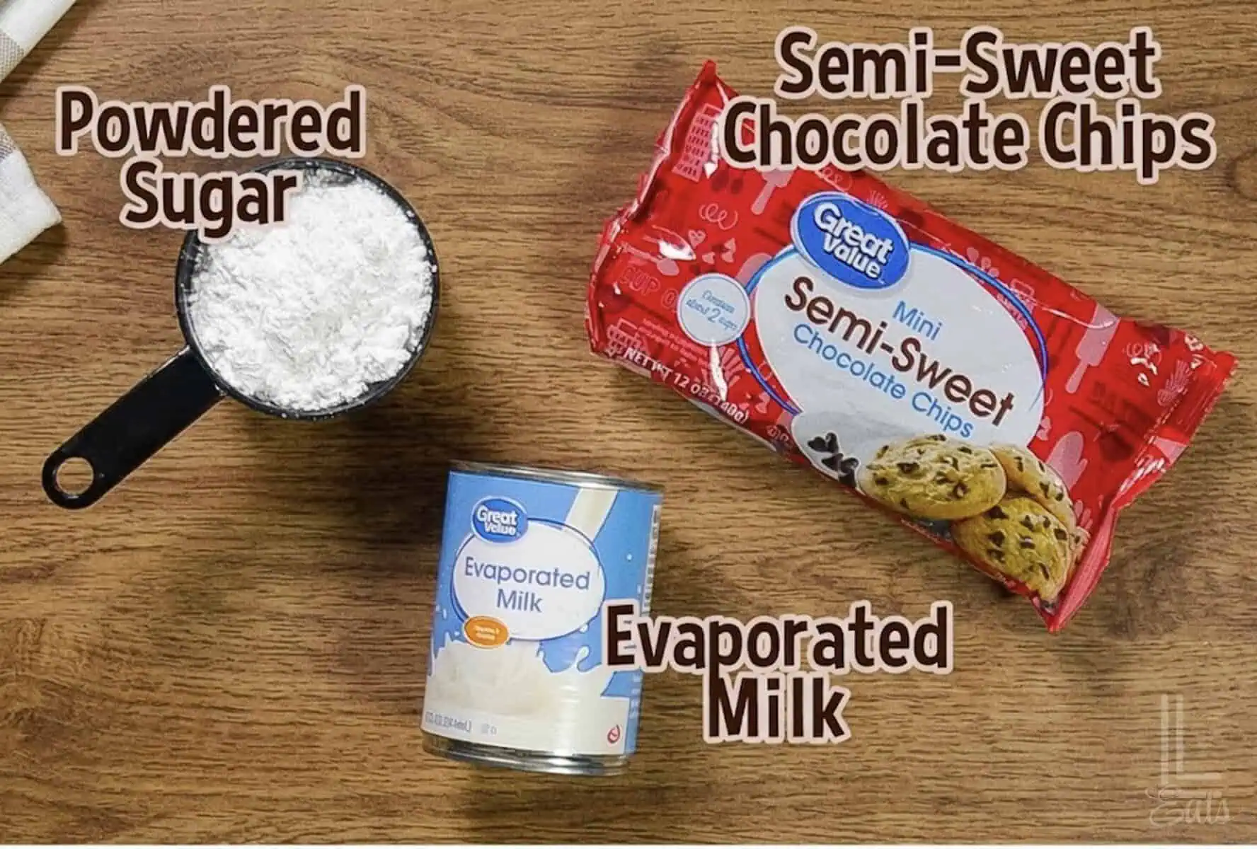 3 ingredients for an easy chocolate dip; evaporated milk, semi-sweet chocolate chips, and powdered sugar.