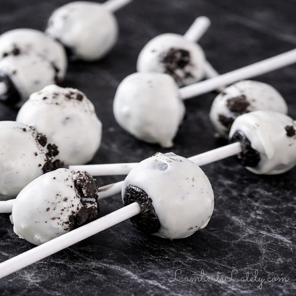 oreo cake pops laying on a counter.