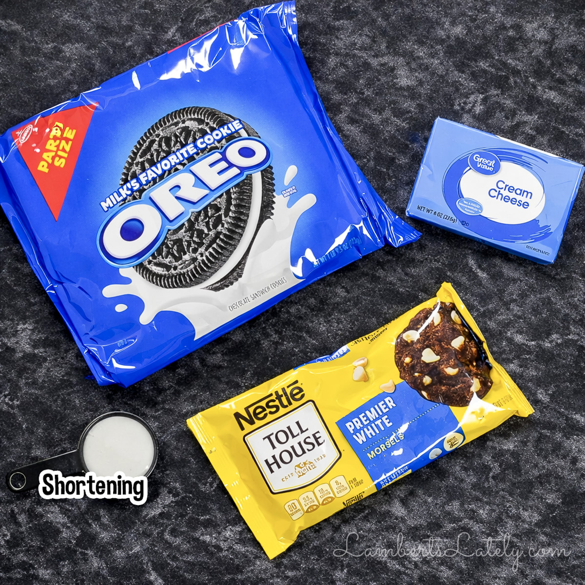 ingredients for oreo cake pops; white chocolate chips, cream cheese, oreo cookies, and crisco shortening.