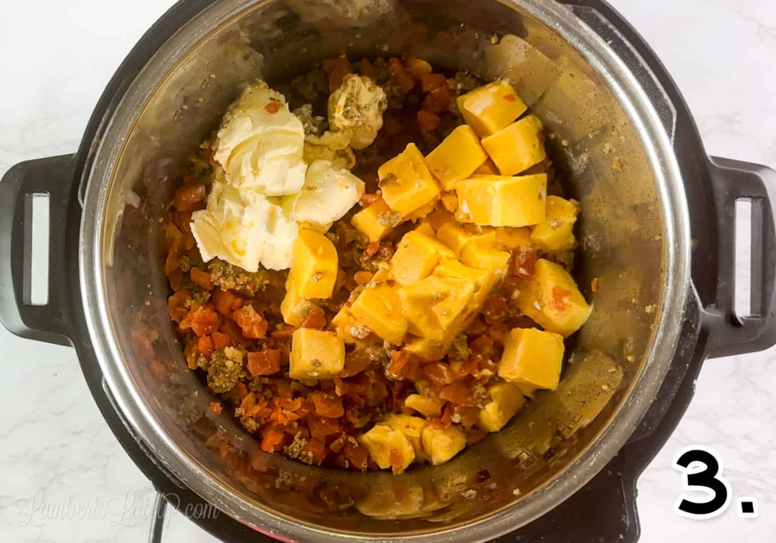 added cream cheese and velveeta to rotel and sausage mixture in instant pot.