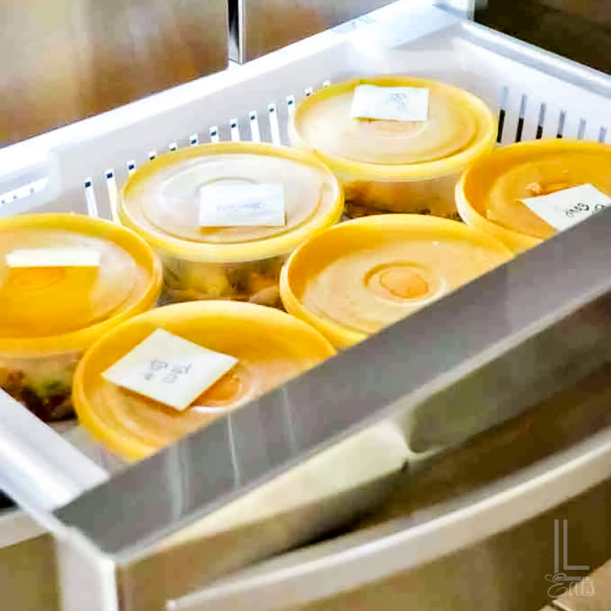 instant pot freezer meals in large plastic containers, in a drawer freezer.