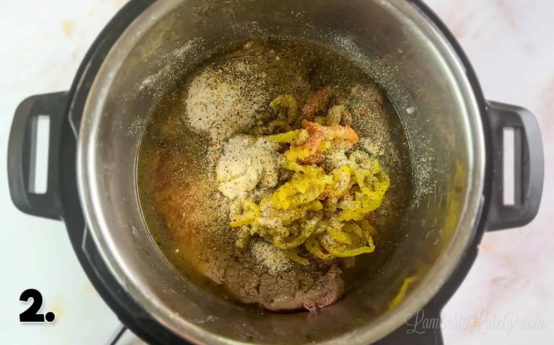 ingredients for italian beef poured into an instant pot.