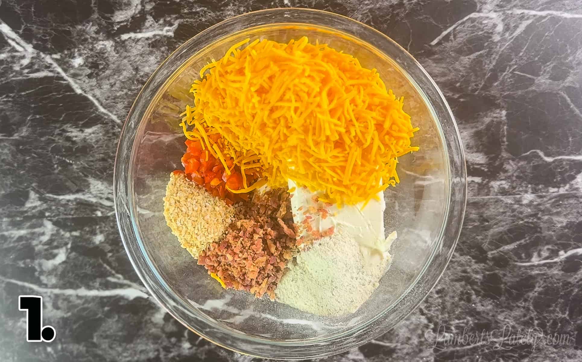cheese ball ingredients in a glass bowl.