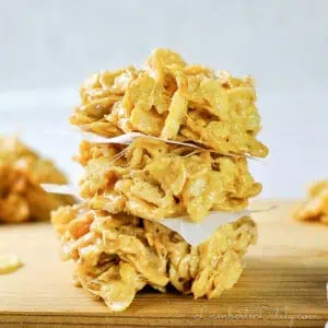 stack of no bake cookies on a cutting board.