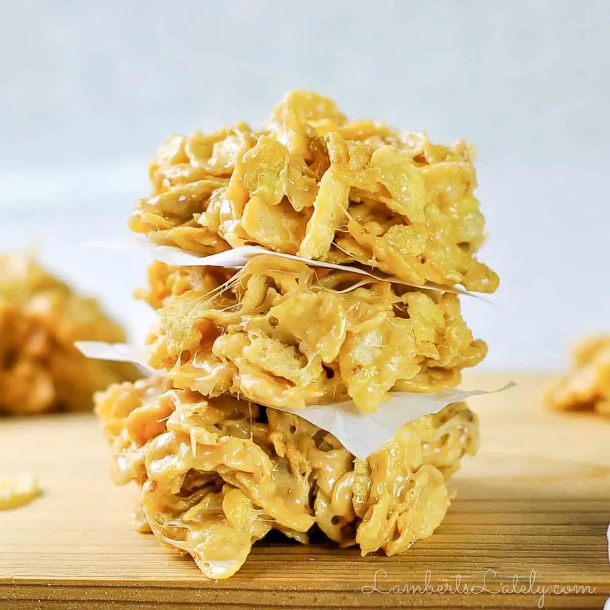 stack of no bake cookies on a cutting board.