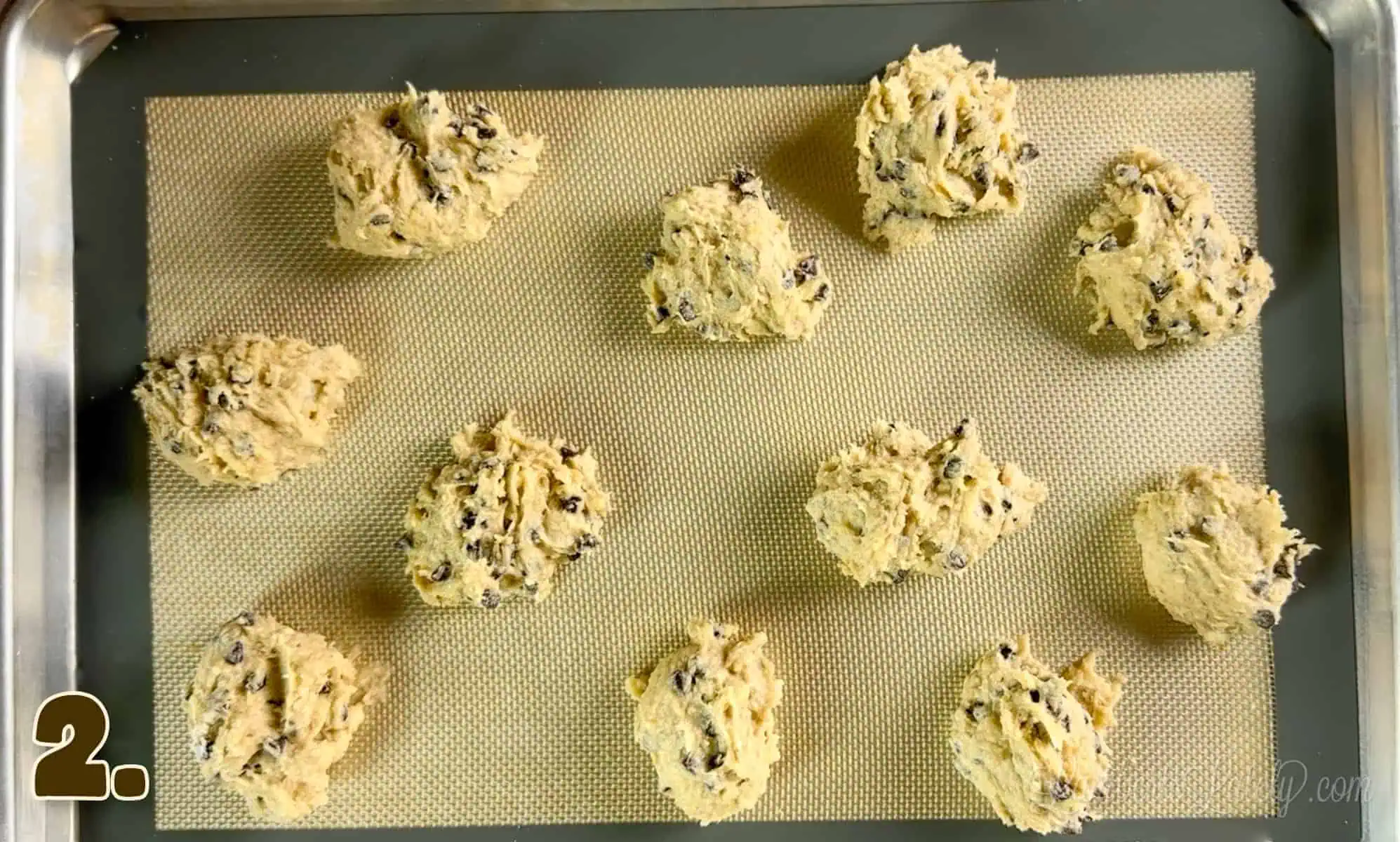 uncooked banana bread chocolate chip cookies on a baking sheet.