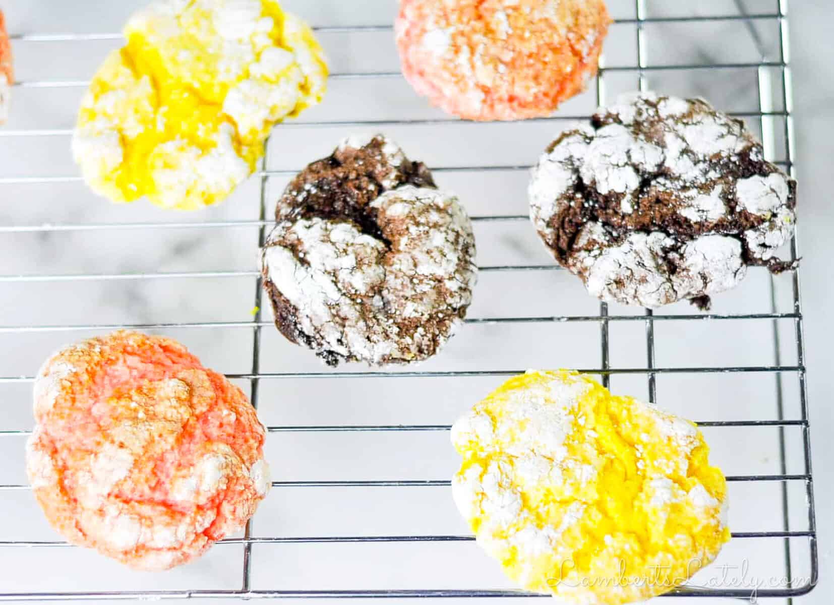 lemon, chocolate, and strawberry cake mix cool whip cookies on a baking rack.