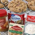 Loaded cookie butter cookies with chocolate chips, walnuts, and biscoff on a cooling rack.