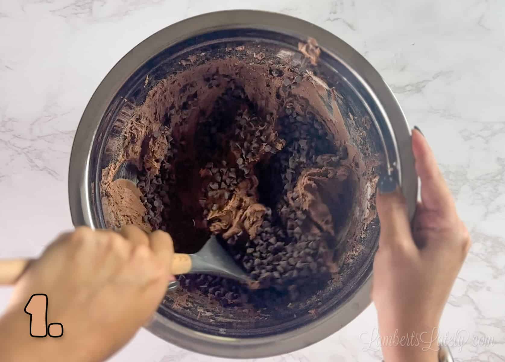 mixing brownie mix cookie dough in a bowl.