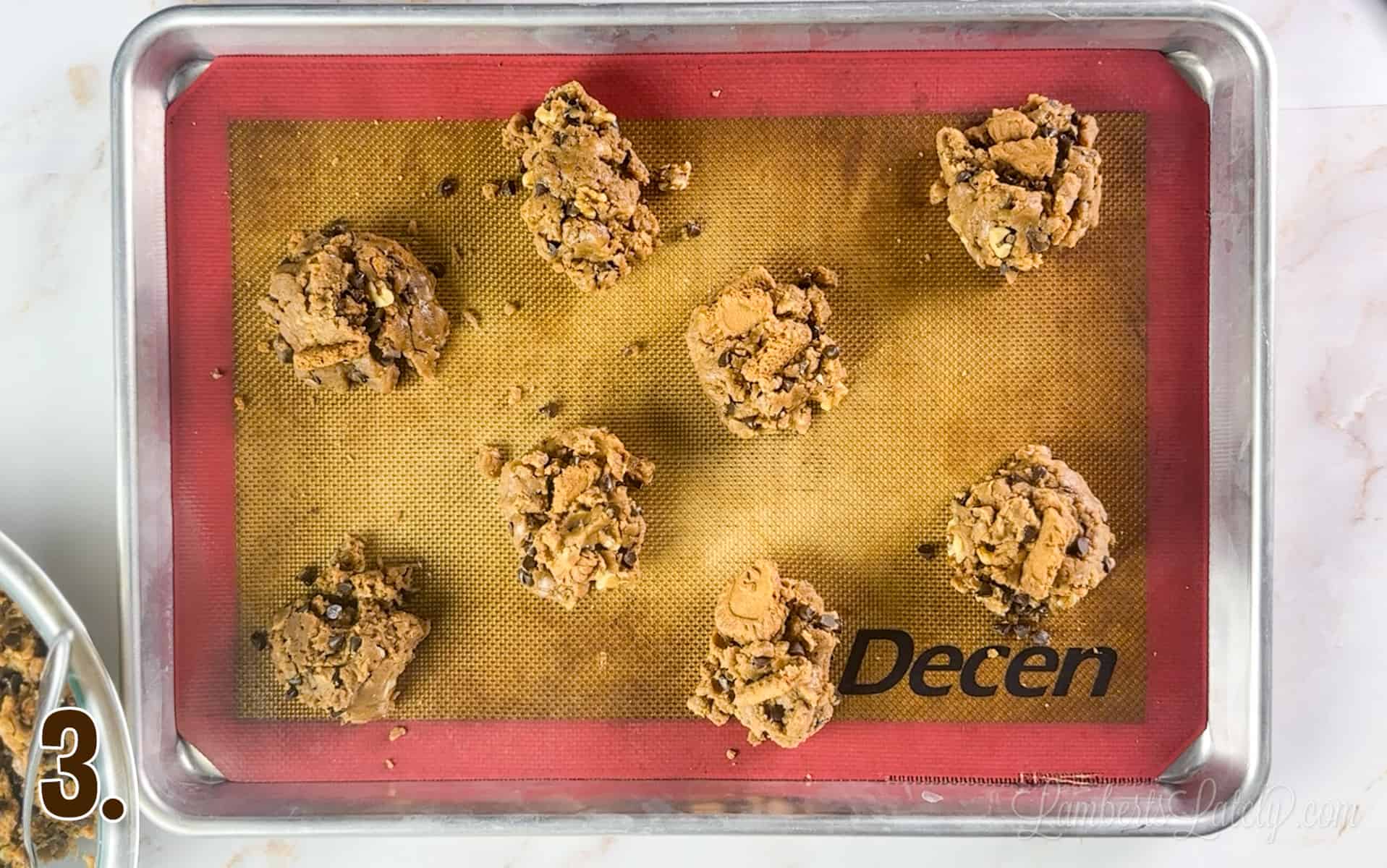 cookie butter cookie dough on a baking sheet.