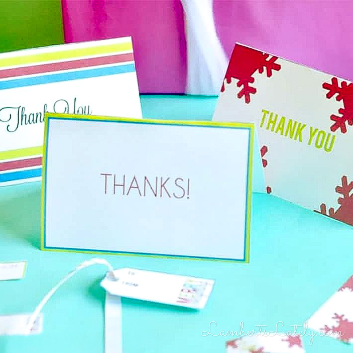 thank you notes spread out with gift tags and ribbon.