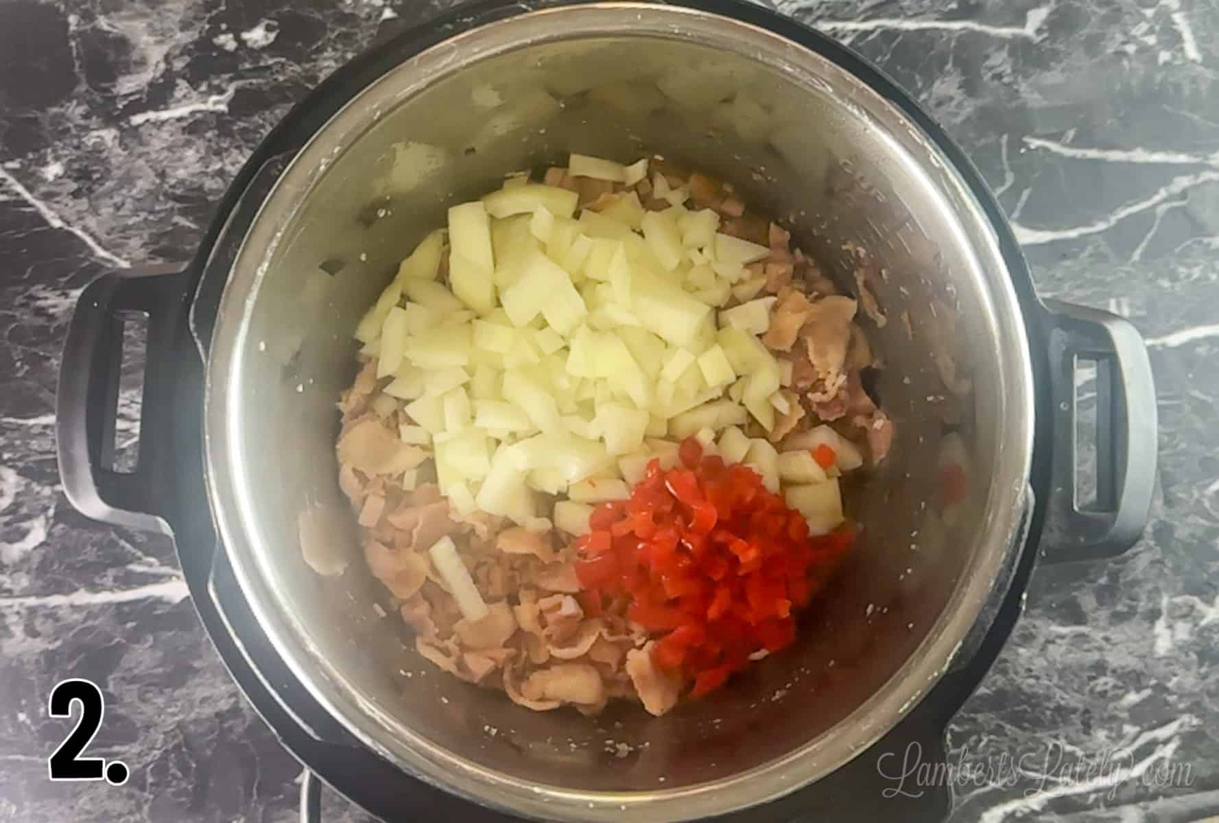 adding onion and pimento to meat mixture in instant pot.