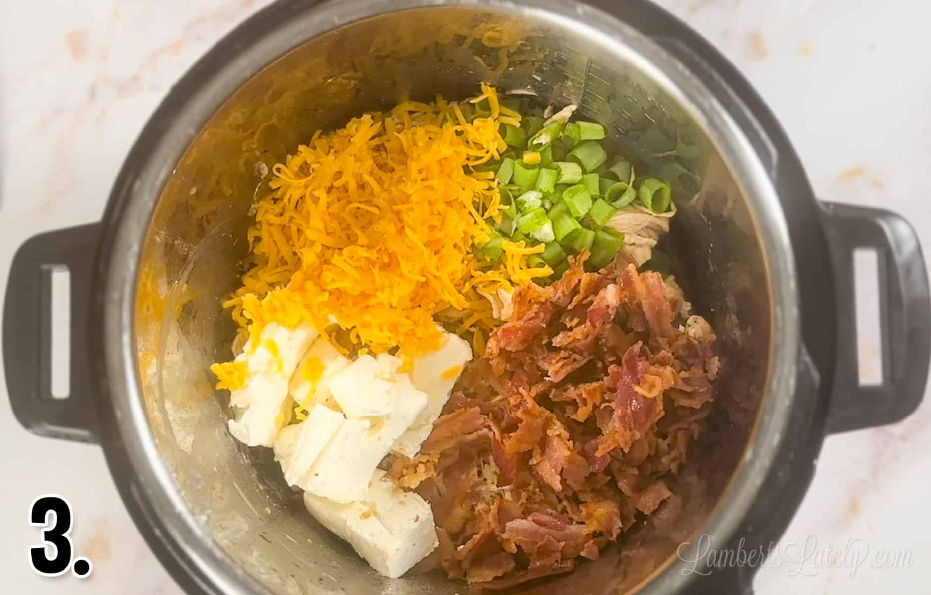 cream cheese, bacon, cheddar, and green onions over chicken in an instant pot.