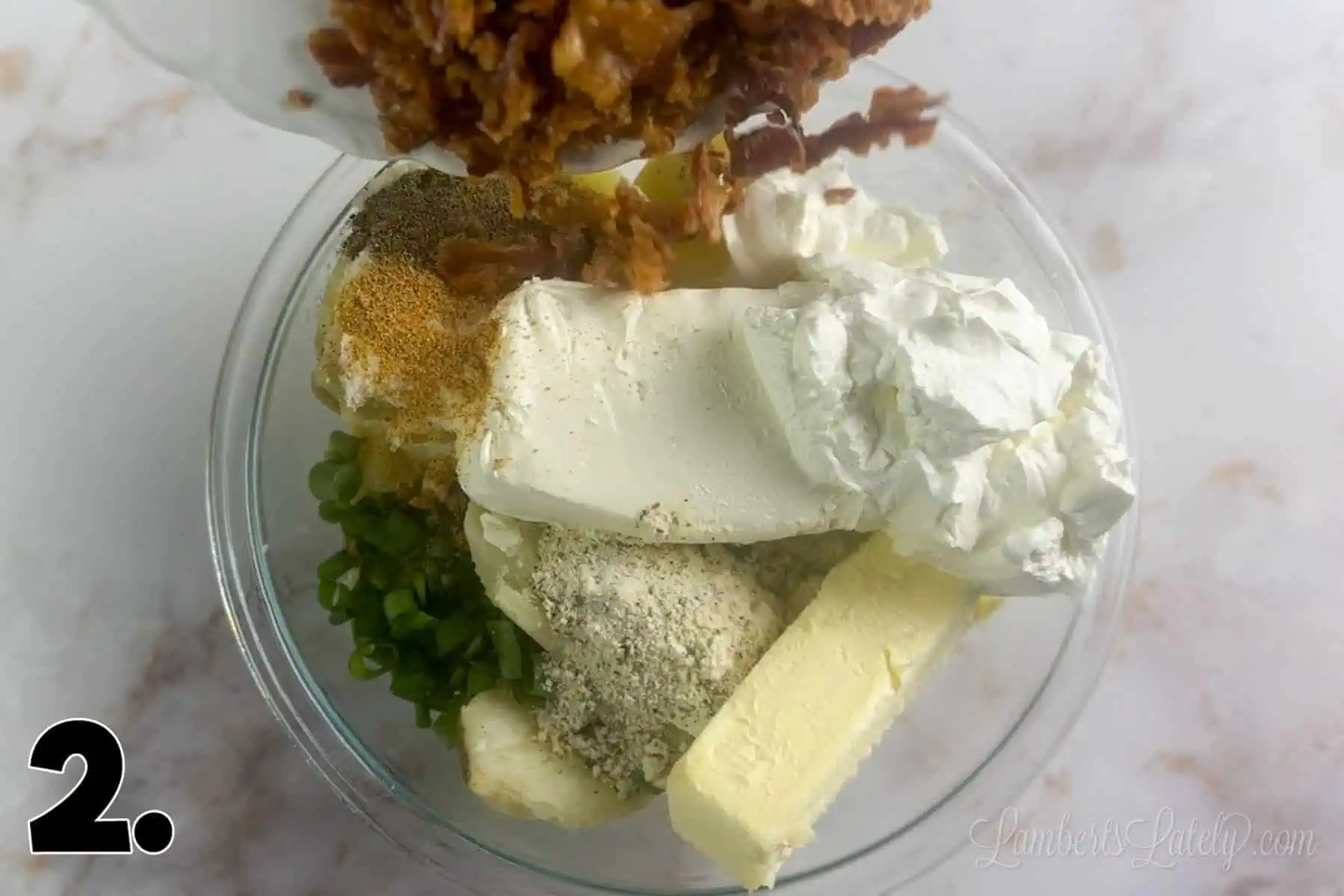 ingredients for twice baked mashed potato casserole in a bowl.
