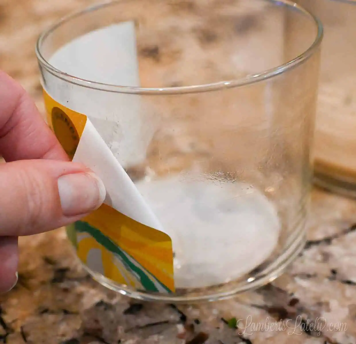 removing a label from a glass jar.