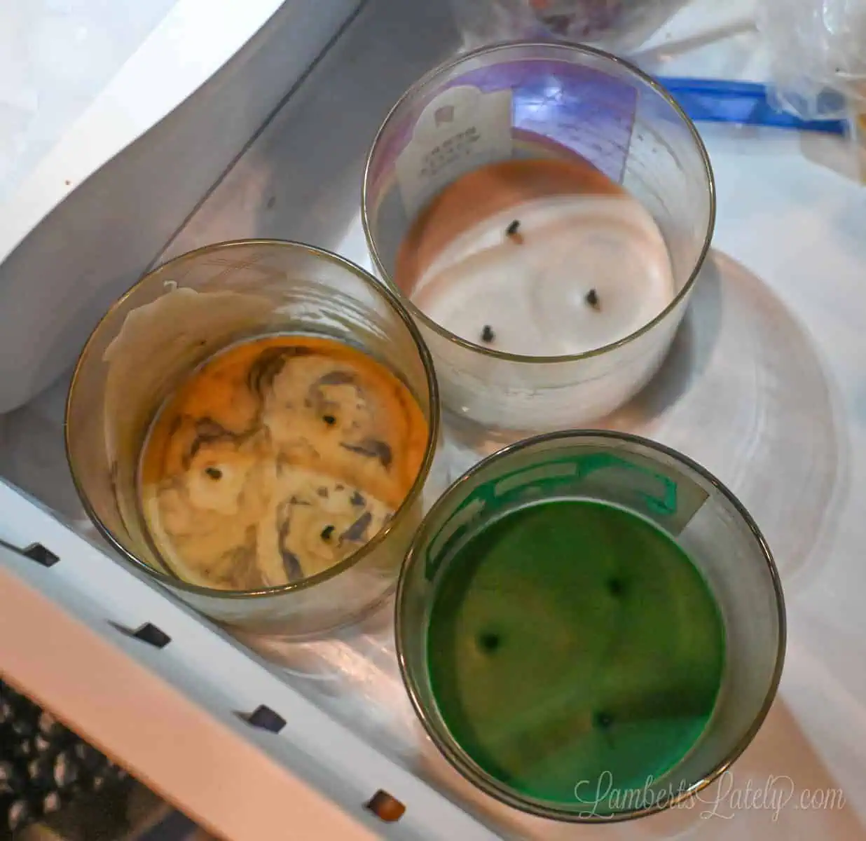 three used candles in the freezer.