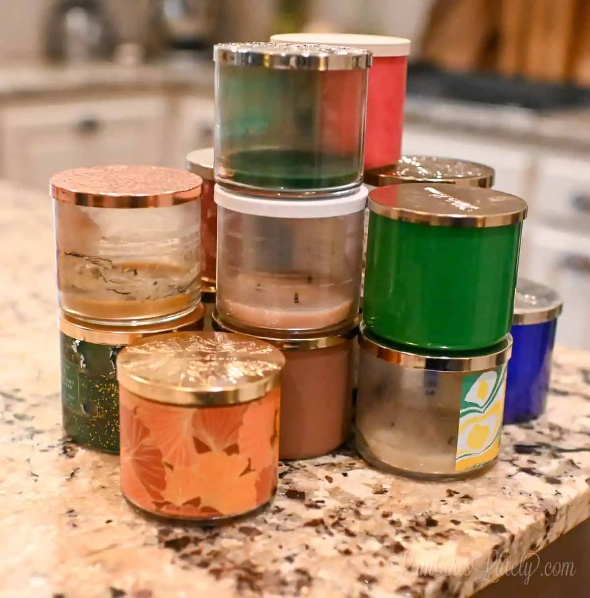 old candle jars on a counter.