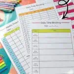 Printable time blocking templates with colorful pens and sticky notes for daily planning.