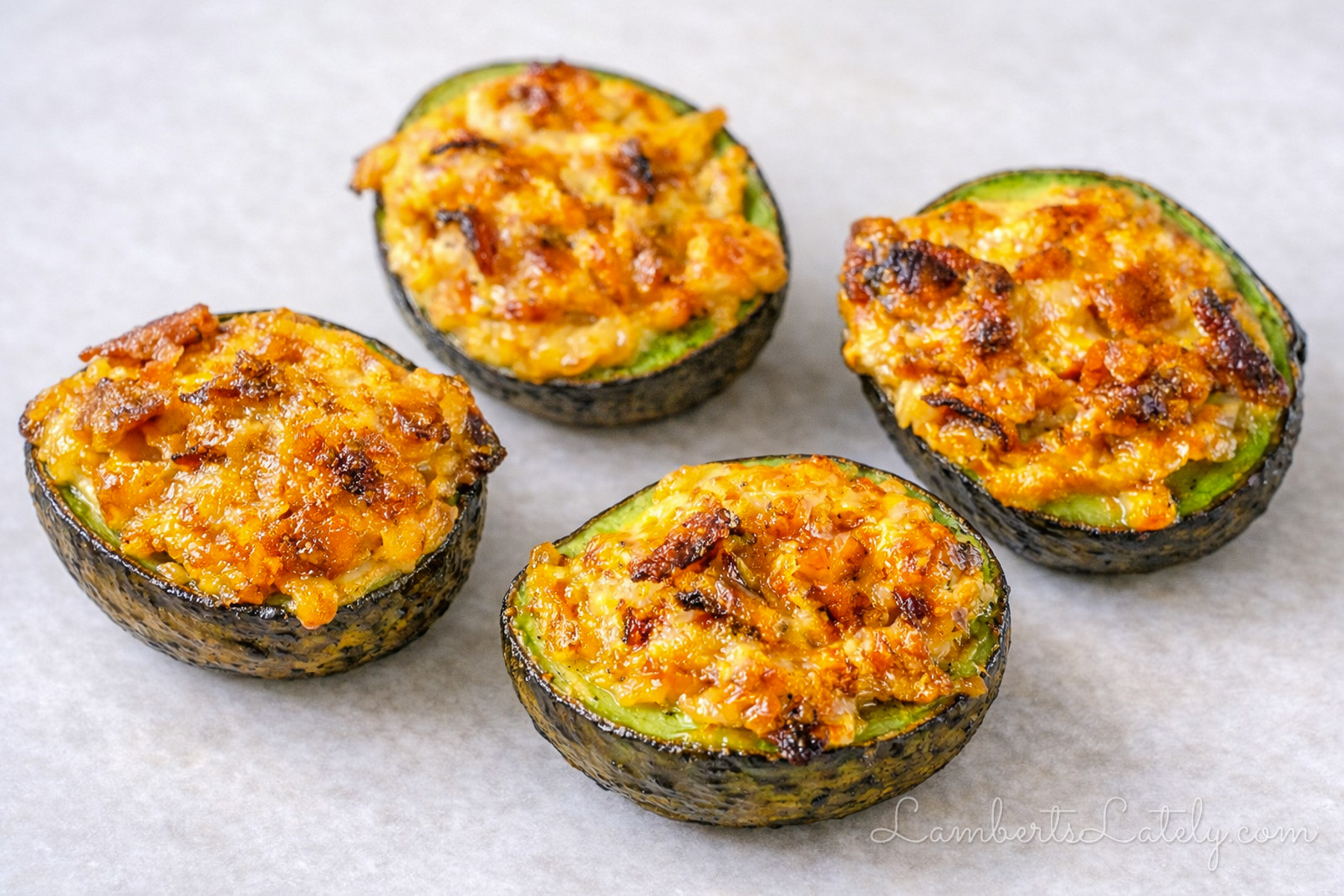 baked avocado halves with bacon and cheese filling.
