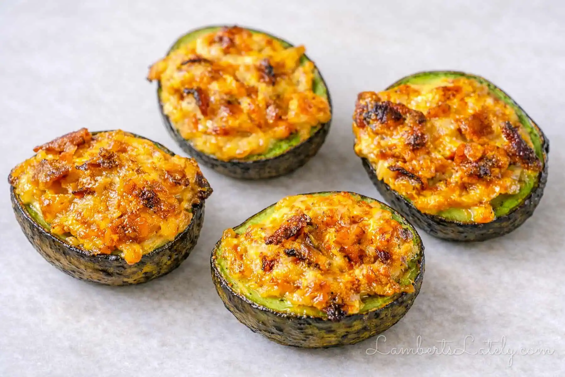 baked avocado halves with bacon and cheese filling.