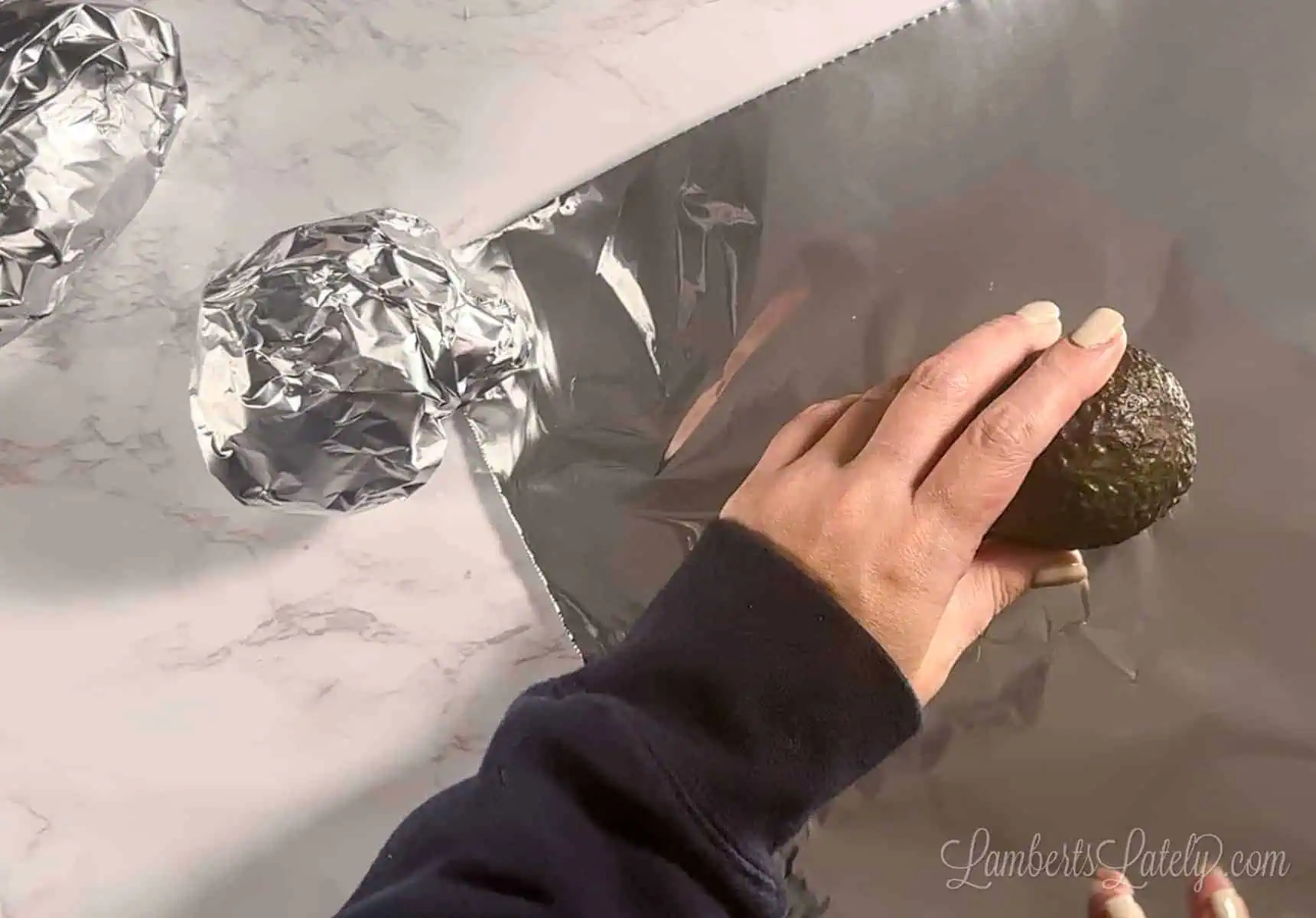wrapping avocados in aluminum foil.