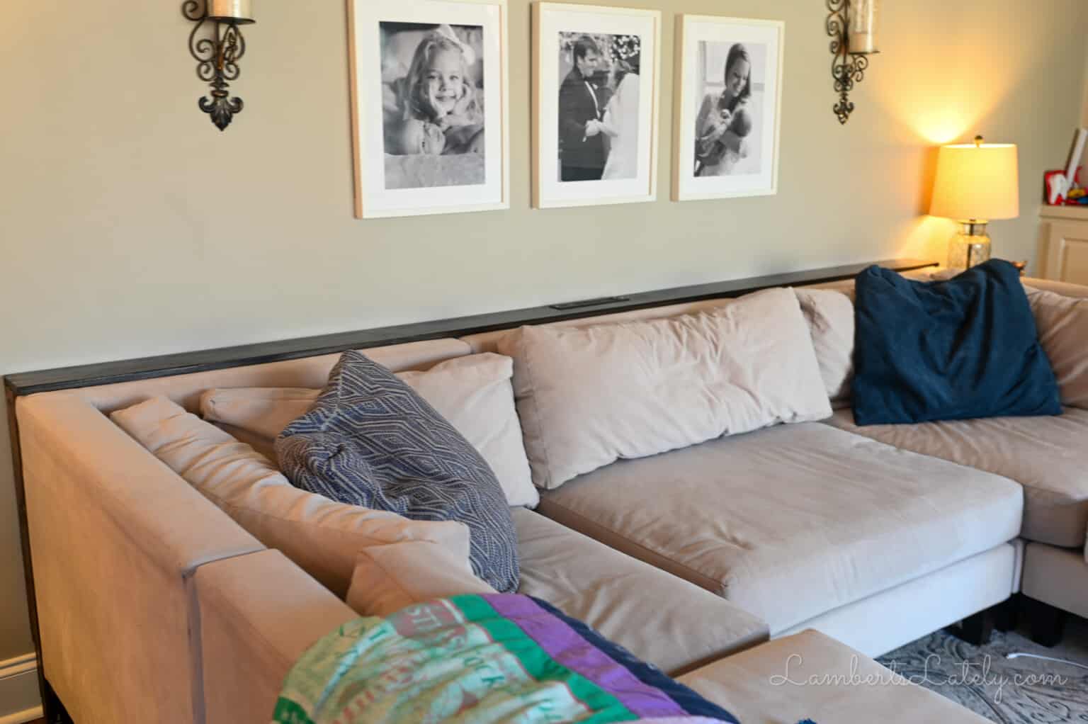 sofa table behind a large sectional couch.