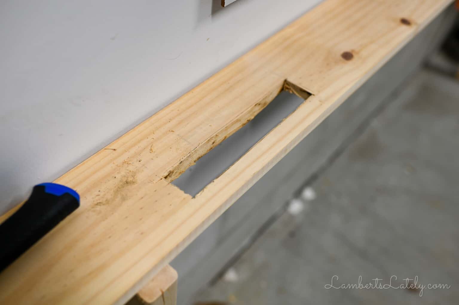 hole cut in table for power strip.