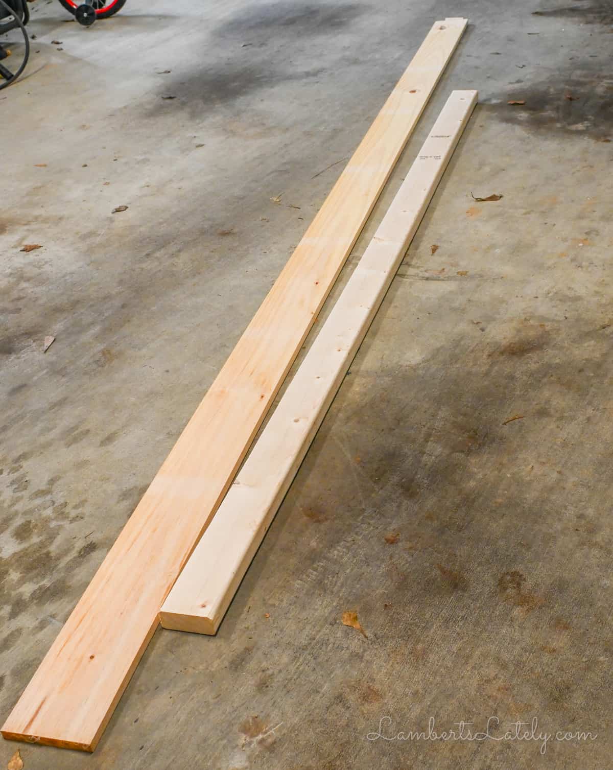 1x6 and 2x4 on a garage floor.