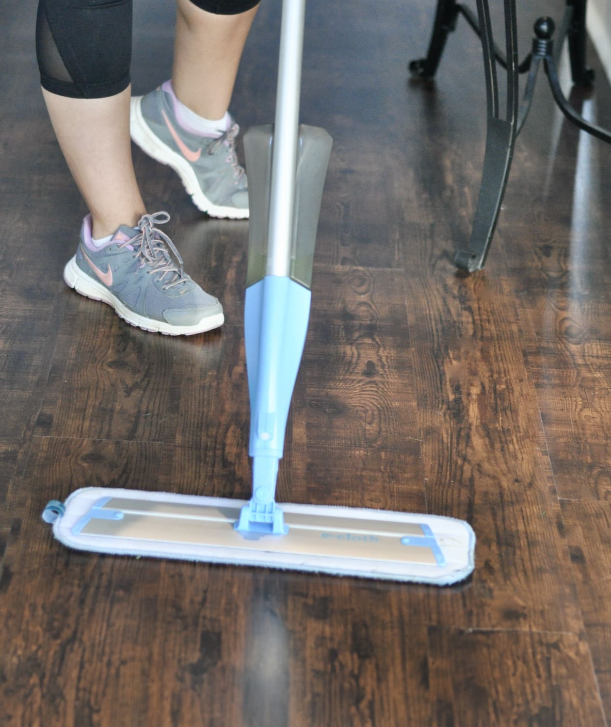 mopping a wood floor.