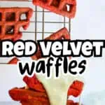 Red velvet waffles stacked with white chocolate drizzle on a cooling rack.