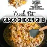 Close-up of crack chicken chili in a black slow cooker with shredded cheese and chicken.