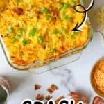 Loaded crack potatoes with bacon, cheddar, and ranch in a baking dish.