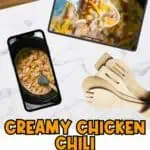 Creamy chicken chili with bacon and cheddar served in a bowl with a fork.