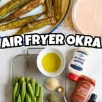 Crispy air fryer whole okra with dipping sauce and seasonings on a kitchen counter.
