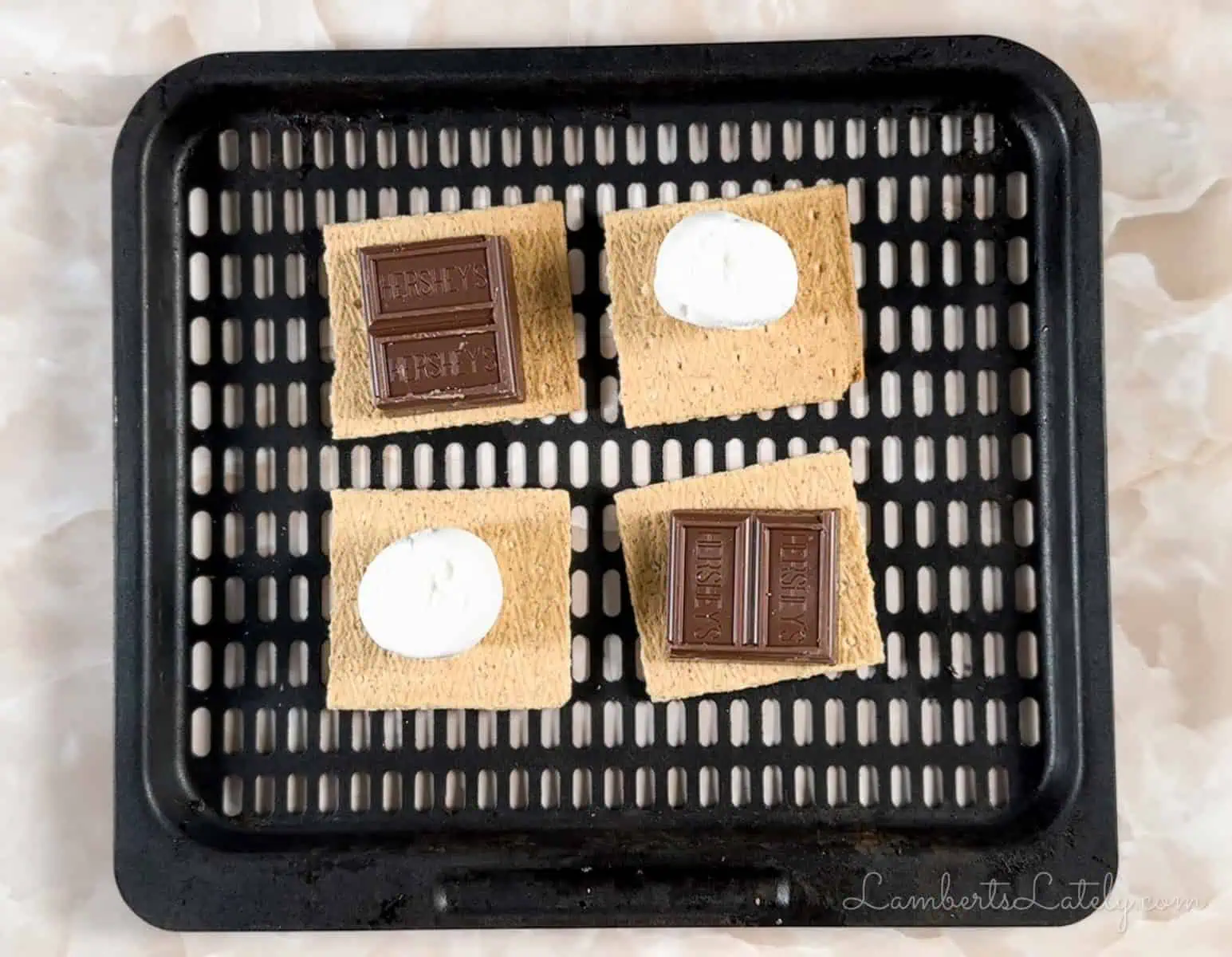 ingredients for smores layered on a pan.
