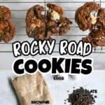 Close-up of Rocky Road Cookies with marshmallows and chocolate chips on a cooling rack.