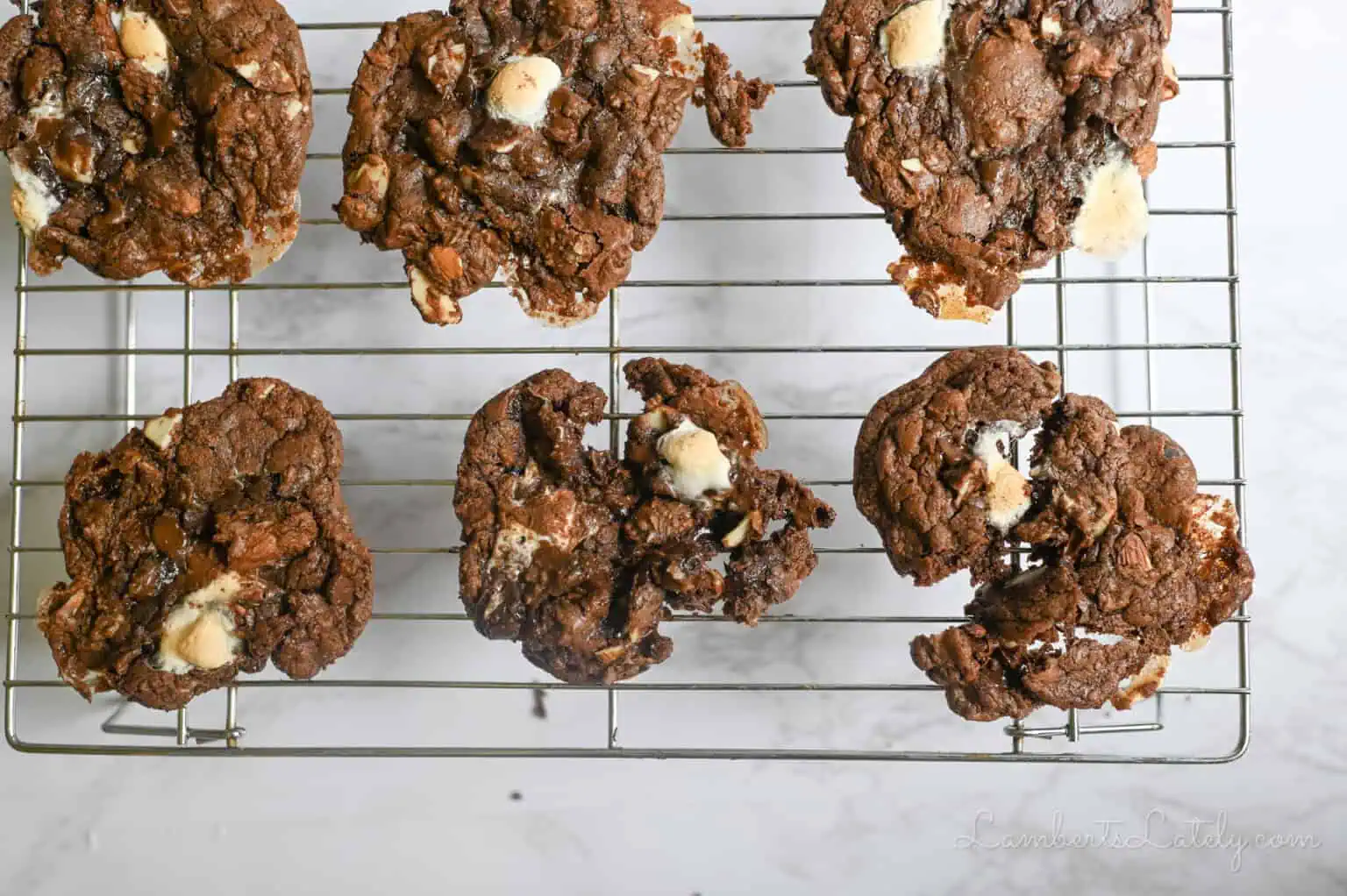 rocky road cookies on a baking rack.
